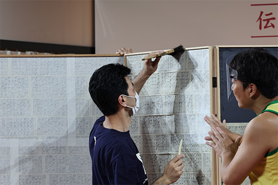 Demonstration of Mounting Paper on a Wooden Base